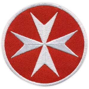 May include: Circular embroidered patch with a red background and a white Maltese cross. The cross has eight points and is centrally positioned. The patch has a white border and is suitable for clothing or accessories.