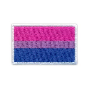 May include: Embroidered patch of the bisexual pride flag. The rectangular patch shows three horizontal stripes: a top stripe of hot pink, a middle stripe of lavender, and a bottom stripe of blue. The patch has a white border.