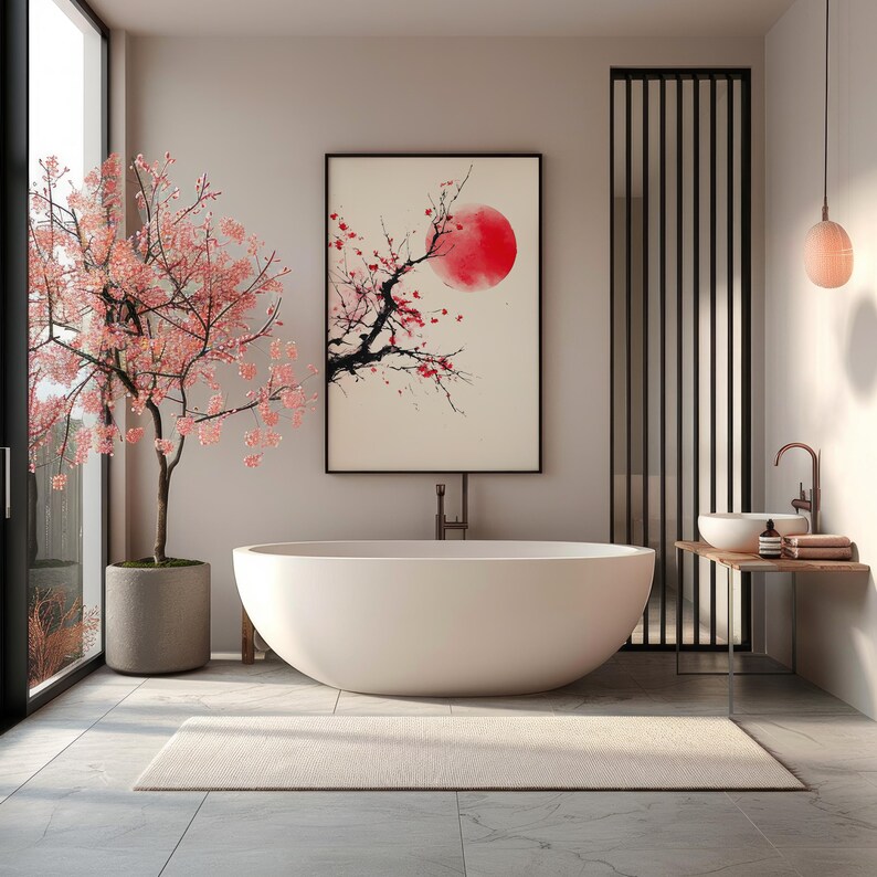 May include: A modern bathroom with a large, white oval bathtub. A framed artwork depicting a red sun and cherry blossoms hangs above the tub. A cherry blossom tree in a concrete pot stands near a large window. A neutral rug is on the floor.