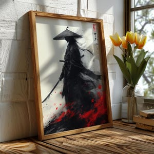 Peut inclure: Une impression d'art encadrée représente un guerrier samouraï en noir, tenant un katana. L'œuvre présente un contraste saisissant avec des touches de rouge à la base, sur fond blanc. Le cadre en bois ajoute une touche naturelle.