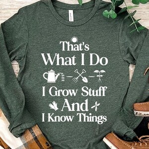 May include: A long-sleeved green t-shirt with white text that reads "That's What I Do - I Grow Stuff And I Know Things". The text is accompanied by a gardening-themed graphic with a watering can, shovel, and plant.