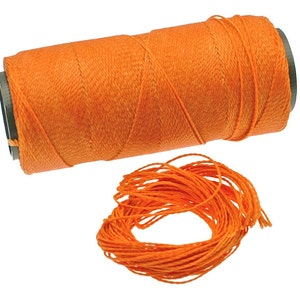 May include: A spool of bright orange waxed thread, perfect for leather crafting or other projects. The thread is wound tightly on the spool and is ready to be used.