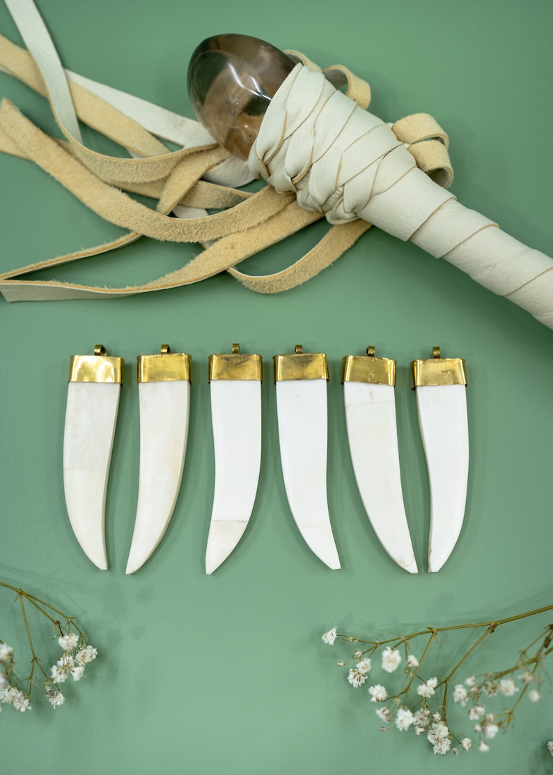 Cream white bone tusk pendant handcrafted in India from recycled cow bone, perfect for bold jewelry designs with an earthy bohemian and tribal-inspired feel.