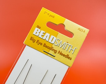 May include: A pack of four 5-inch big eye beading needles from the Beadsmith brand. The needles are packaged in a yellow and white cardboard package with a hang hole.