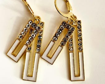 Elegant geometric earrings with rhinestones – Gold-colored women's earrings with white enamel design, Art Deco style