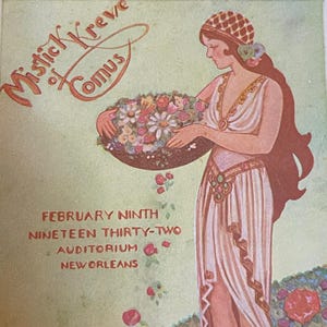 May include: A vintage poster advertising the Mystic Krewe of Comus parade in New Orleans, Louisiana. The poster features a woman in a white gown holding a basket of flowers. The text on the poster reads "February Ninth Nineteen Thirty-Two Auditorium New Orleans".