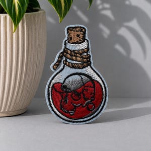 Skull Red Potion Embroidered Iron On Patch: Edgy Halloween Applique