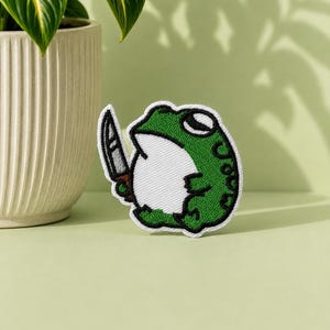 Frog With Dagger Embroidered Iron-On Patch