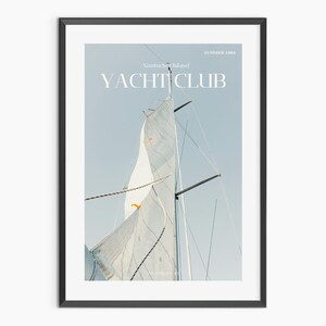 May include: A white sailboat with a large sail billowing in the wind. The sail is partially obscured by the mast and rigging. The text "YACHT CLUB" is printed in white on a blue background.