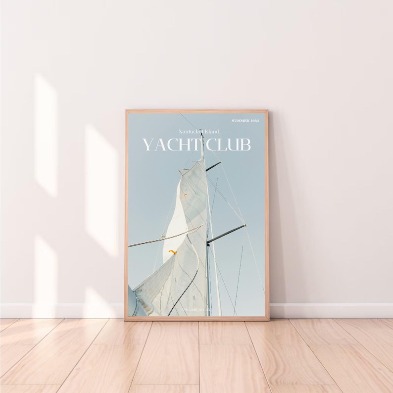 May include: A magazine cover with the title "YACHT CLUB" in white text on a light blue background. The cover features a close-up of a sailboat's sail billowing in the wind.
