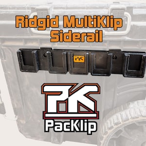 Può includere: Un organizzatore di strumenti nero Ridgid MultiKlip Siderail per una cassetta degli attrezzi. L'organizzatore ha cinque slot ed è etichettato con il logo PackKlip.
