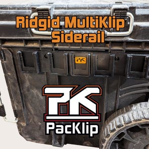 May include: A black Ridgid toolbox with a PackKlip side rail attachment. The side rail is black and features a PackKlip logo. The toolbox has a black handle and a black wheel.