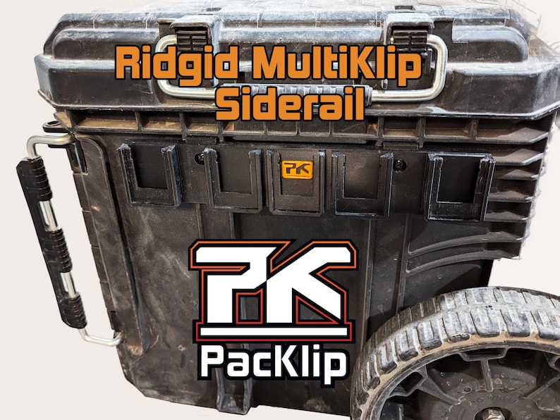 May include: A black Ridgid toolbox with a PackKlip side rail attachment. The side rail is black and features a PackKlip logo. The toolbox has a black handle and a black wheel.