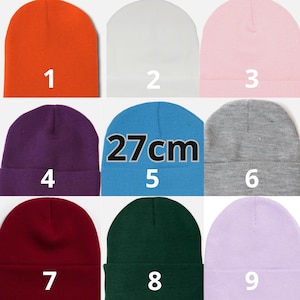 May include: Nine beanies in various colors are displayed. The colors include orange, white, pink, purple, blue with "27cm" text, gray, burgundy, dark green, and lavender. Each beanie is numbered from 1 to 9.