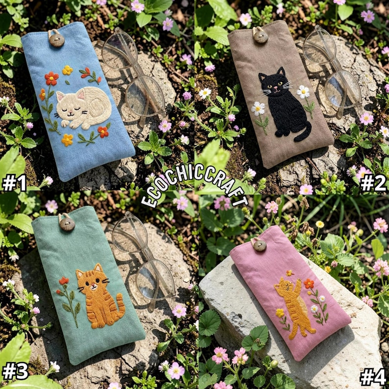 May include: Four rectangular fabric eyeglass cases featuring embroidered cat designs and wooden button closures. Each case displays a unique cat illustration surrounded by floral motifs in blue, tan, green, and pink fabric colors.