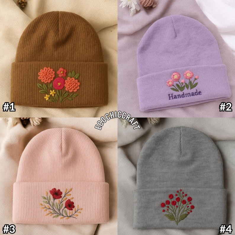 May include: Four beanies in different colors: brown, lavender, pink, and gray. Each beanie features an embroidered floral design on the folded brim. The lavender beanie has the word "Handmade" embroidered below the flowers.