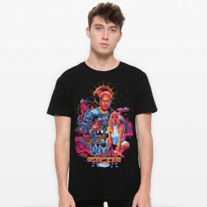 May include: Black t-shirt featuring a graphic print of a movie poster with a group of people in a futuristic setting. The poster includes the text "The Last Starfighter".