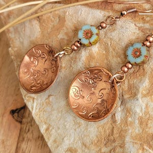 Copper  earrings.....Stamped with glass Hibiscus Flower Czech Bead