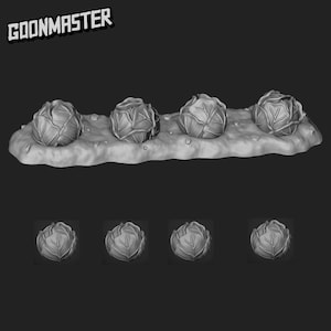 Può includere: Immagine in scala di grigi di quattro sculture di cavolo su una base strutturata. I cavoli presentano dettagli di foglie visibili. La parola "GOONMASTER" è stampata in alto a sinistra.