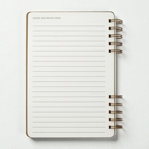Interior notes page of the reading journal labeled “Notes and Reflections,” featuring full-page lined space for writing. Journal is photographed open with the wire binding visible on the right side against a clean white background.