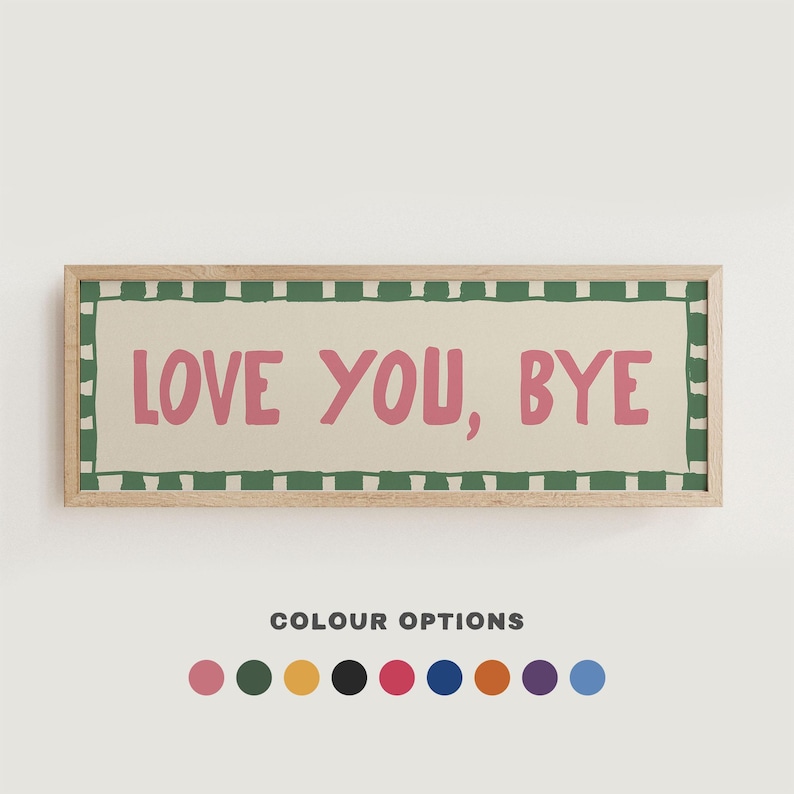 A wooden framed sign with a green and white checkered border. The sign has a cream background with the words "LOVE YOU, BYE" written in pink.
