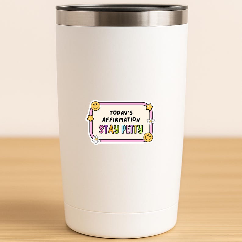 May include: A white stainless steel tumbler with a sticker that reads "TODAY'S AFFIRMATION STAY PETTY" in a colorful, retro design. The sticker features a purple border, yellow stars, smiley faces, and flowers.