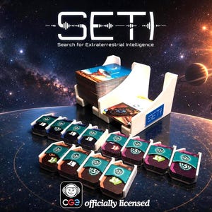 May include: A board game titled SETI: Search for Extraterrestrial Intelligence featuring a white plastic card holder containing decks of cards, alongside several smaller stacks of cards held in white plastic trays with teal bands and numerical icons.