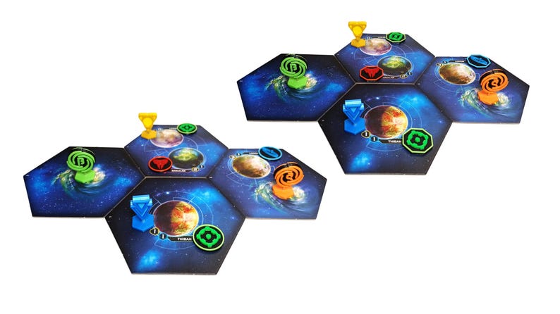 May include: Two clusters of hexagonal board game tiles featuring space-themed illustrations of planets and nebulae. The tiles are arranged in groups, topped with various plastic game pieces in blue, green, yellow, orange, and red colors.