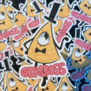 May include: A yellow triangle-shaped character with a black top hat, bow tie, and one eye. The character is standing on a pink banner with the text "GIRL BOSS" in white letters.
