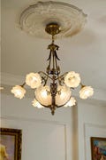 Vintage-Inspired Floral Chandelier: Ornate Bronze Pendant Light with Frosted Glass