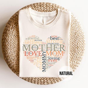 May include: A set of three ceramic mugs with a speckled, matte finish. The mugs are in shades of cream, light gray, and dark gray. Each mug has a simple, minimalist design, perfect for coffee or tea.