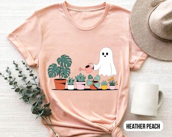 Camiseta de planta fantasma, linda camiseta gráfica de Halloween con plantas suculentas para regar, camiseta de otoño para mamás con estética cottagecore espeluznante, top de color melocotón jaspeado