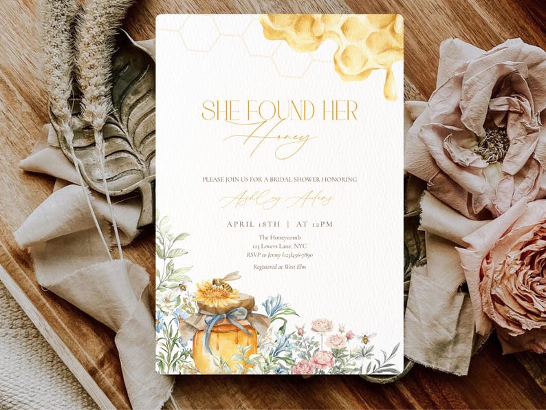 May include: A bridal shower invitation with the text "SHE FOUND HER Honey" in gold script. The invitation features watercolor illustrations of a honey jar, flowers, and a honeycomb design. The date and time of the event are also included.