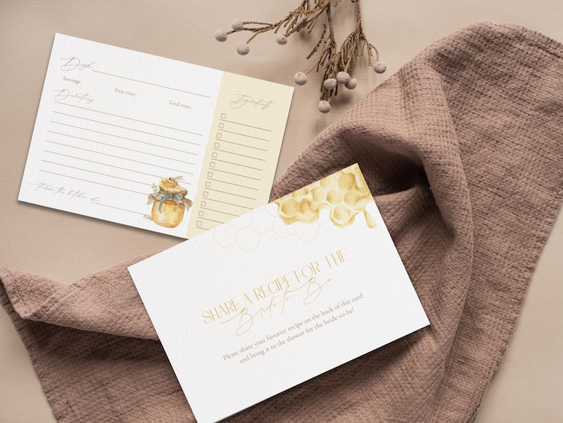 May include: Recipe cards and a "Share a Recipe" card with gold lettering are displayed on a mauve cloth. The recipe cards have a honey pot illustration. The "Share a Recipe" card has a honeycomb design.