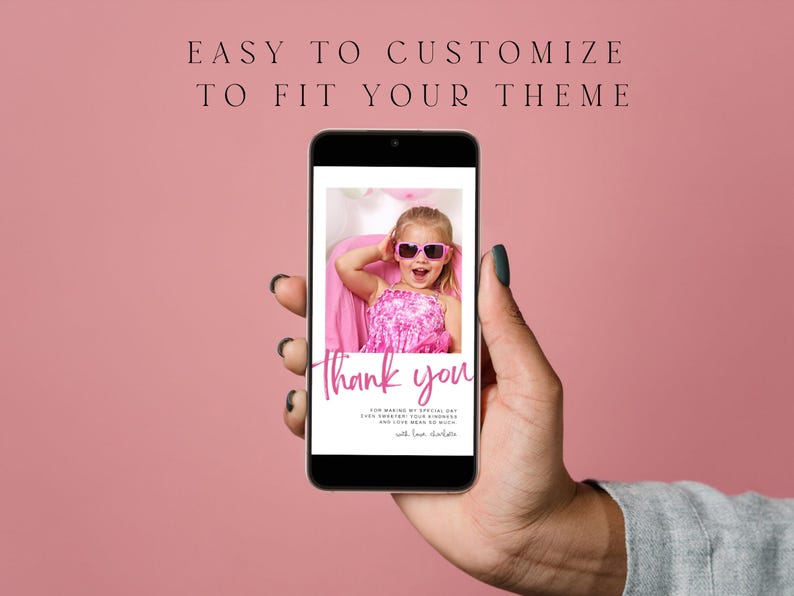 May include: A smartphone displays a pink-themed thank you card. The card features a photo of a young girl wearing sunglasses. The text "Thank you" is written in a cursive font. The background is a solid pink color.
