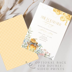 May include: Bridal shower invitation with the text "SHE FOUND HER HONEY" in gold script. The invitation features a watercolor illustration of a honey pot, flowers, and bees. The back of the invitation has a yellow gingham pattern.