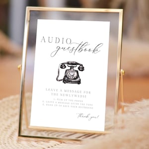 K&ouml;nnte beinhalten: Ein gerahmtes Schild mit den Worten "Audio G&auml;stebuch" in eleganter Schrift. Darunter ist eine Vintage-Telefon-Illustration zentriert. Anweisungen sind darunter aufgef&uuml;hrt, mit einem "Danke!" am unteren Rand.