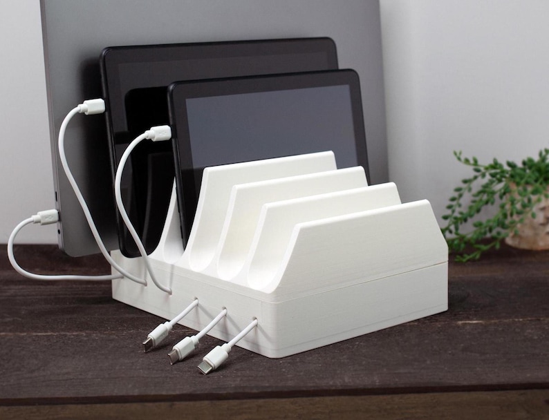 Family charging ipad tablet holder dock station for multiple devices and electronic organizer.