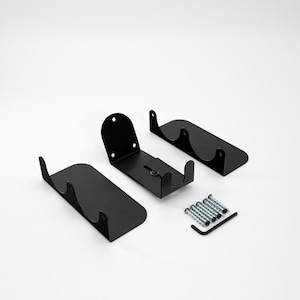 May include: Black metal wall-mounted wine rack components. The set includes three rack pieces, screws, and an Allen wrench. The rack pieces have a curved design to hold wine bottles. The components are on a white background.