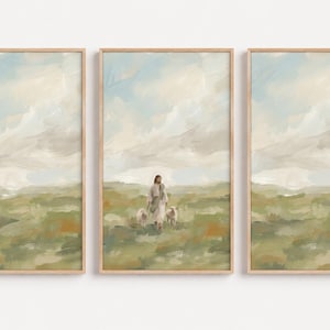 以下が含まれることがあります： 印象派の風景画が描かれた3枚の額入りウォールアートセット。中央のパネルには、曇り空の下、緑の野原を2頭の羊と一緒に歩くローブを着た人物が描かれており、左右のパネルには風景が描かれています。