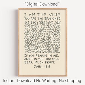 Może przedstawiać: Oprawiony wydruk artystyczny z beżowym tłem i botanicznym wzorem liści. Tekst "I AM THE VINE YOU ARE THE BRANCHES" znajduje się na górze, poniżej werset biblijny. Rama jest w jasnym kolorze drewna.