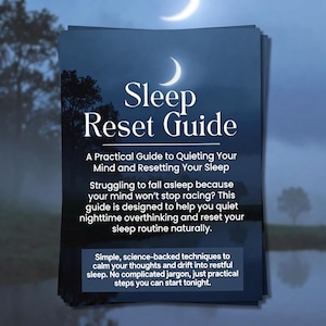 May include: A stack of dark blue guides titled "Sleep Reset Guide." The cover features a crescent moon and text describing the guide's purpose: to quiet the mind and reset sleep. The guide promises simple techniques for restful sleep.