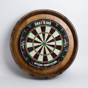 May include: A wooden dartboard with a black and white target, red and green rings, and the text "Shot King" and "Viper Official Competition".