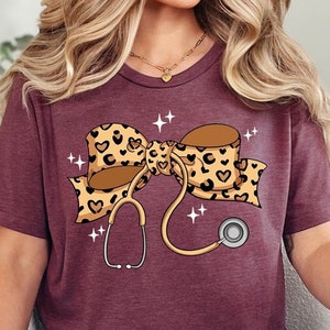 Coquette Nurse Stethoscope Bow Shirt, Christmas Gift for Nurse, Nurse Bow Shirt, Coquette Nurse Shirt, Nurse Gift,Leopard Nurse Ribbon Shirt