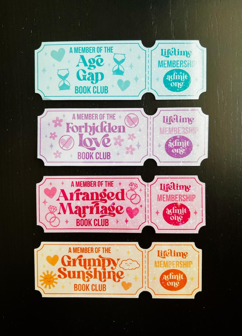 May include: Four colourful ticket-shaped stickers with text. Each ticket is divided into two sections. The left side has the text "A Member of the" followed by a book club name. The right side says "Lifetime Membership" and "Admit One."