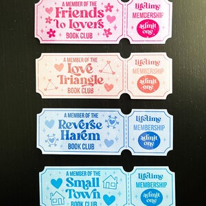 May include: Four colourful book club membership tickets. Each ticket features a different theme: Friends to Lovers, Love Triangle, Reverse Harem, and Small Town. Each ticket includes the text "lifetime membership" and "admit one".