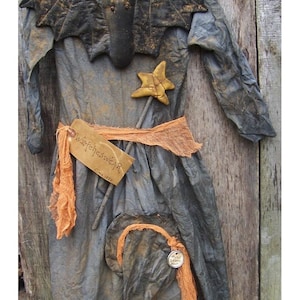 May include: A gray witch costume with a black bat wing applique, a yellow star wand, and a tag that reads "Witch's Wear Circa 1986".