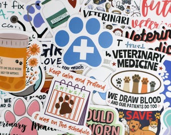 May include: A collection of colorful stickers with veterinary and pet-related themes. Designs include a blue paw print with a white cross, a pill bottle with text, and phrases like "Veterinary Medicine" and "We Draw Blood."