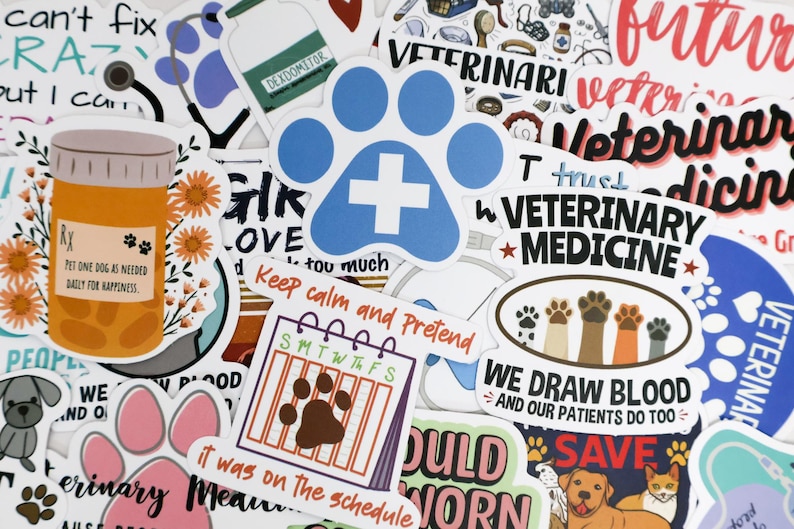 May include: A collection of colorful stickers with veterinary and pet-related themes. Designs include a blue paw print with a white cross, a pill bottle with text, and phrases like "Veterinary Medicine" and "We Draw Blood."