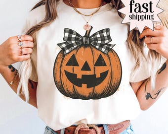 Kürbis-Bogen-Herbst-Hemd Komfort Farben Girly kariertes Halloween-T-Shirt Spooky Saison Grafik-T-Shirt Süßes Süßes oder Saures Kürbis-Gewürz-T-Shirt